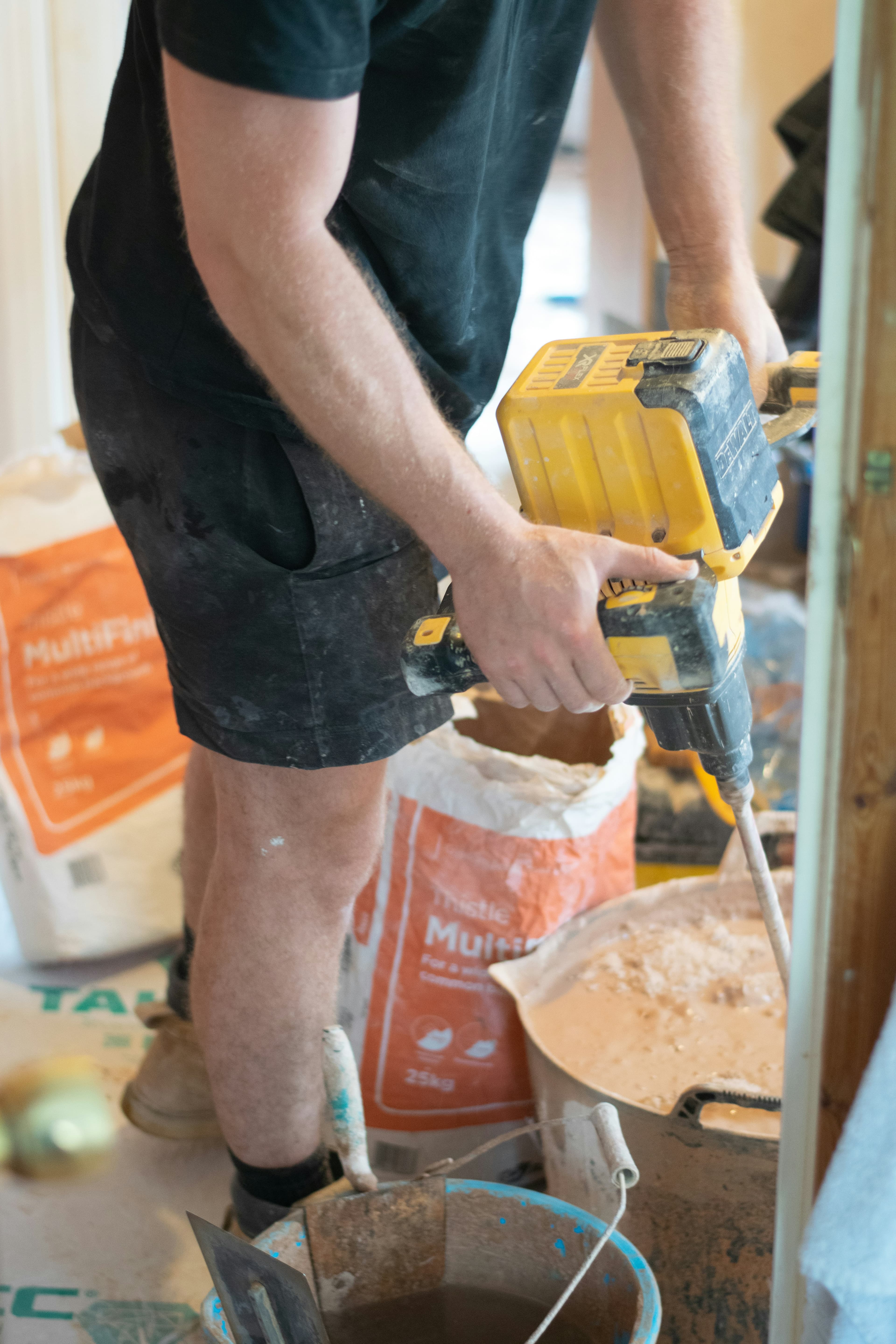 Student developing practical solid plastering skills